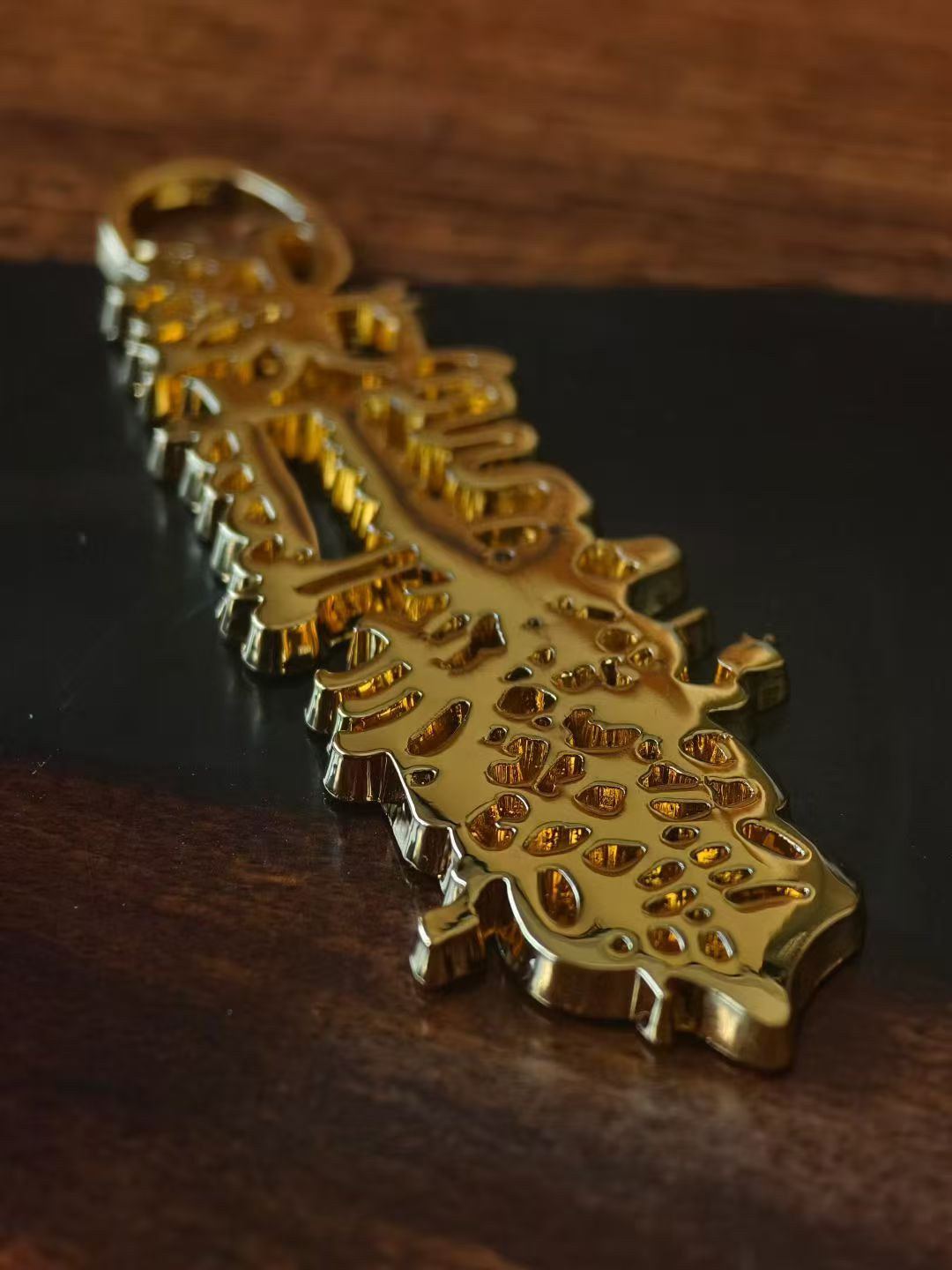 Gold Caishen metal charm detail