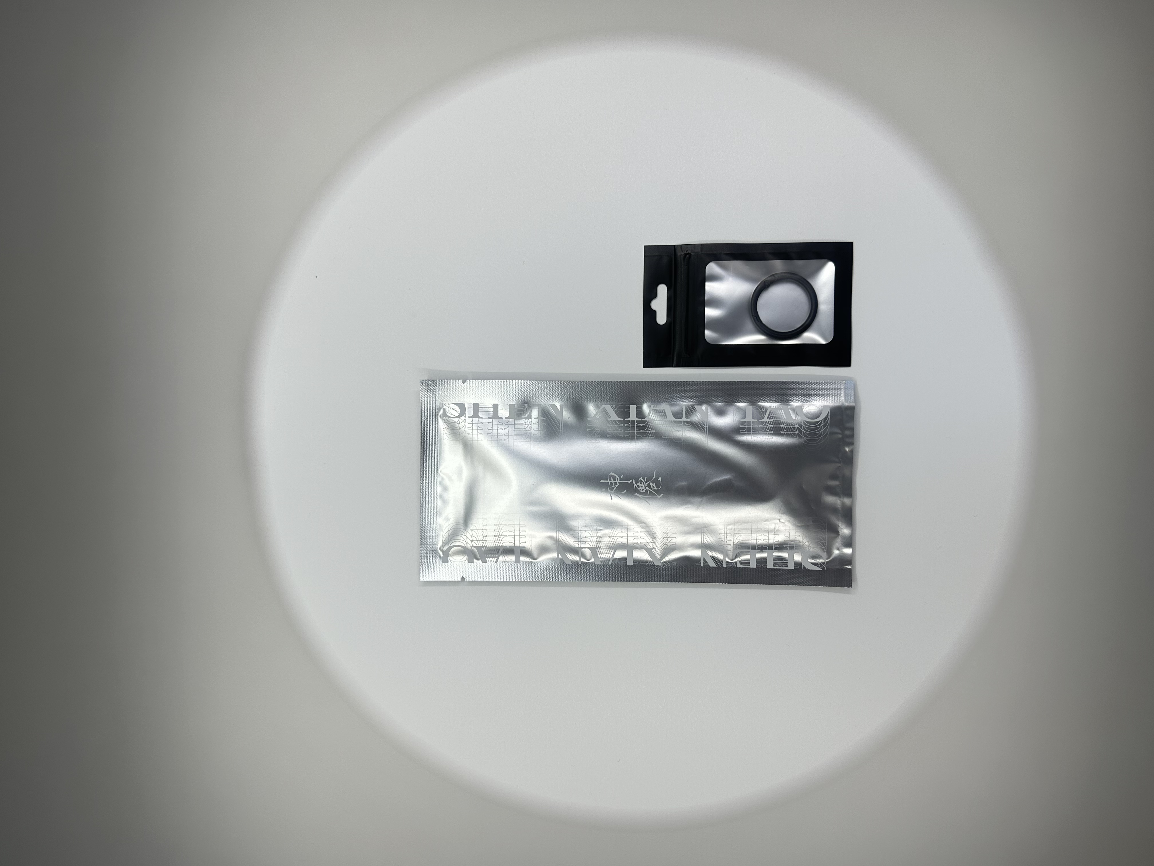 ShenBox silver foil sachet with hang tag